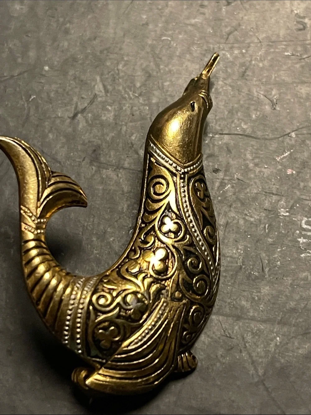 Ornate “Goldtone” and blackDolphin with silver Accent. Sculpture pin/brooch